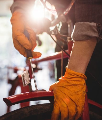 mechanic repairing a bicycle
