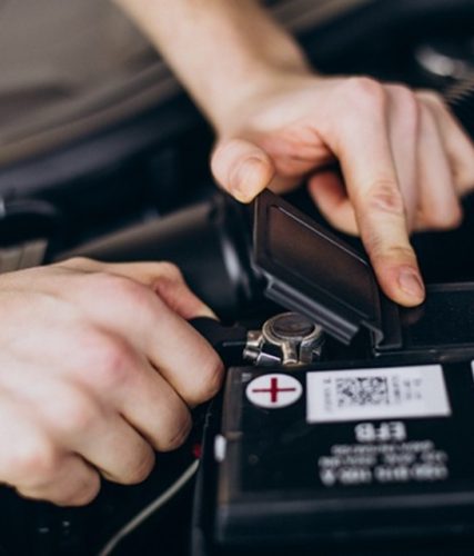 repair man making car service